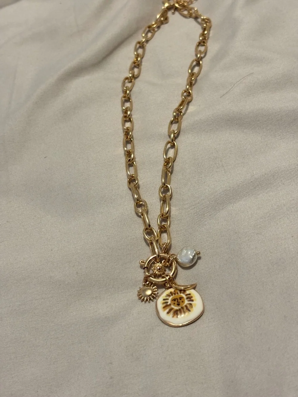 Sun charm necklace